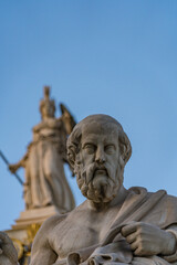 Marble Statue of Plato by Leonidas Drosis. Athena column in the background in front of the Academy of Athens, Greece – May 2025
