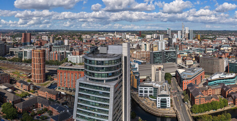 Aerial image of Leeds skyline in Yorkshire, England, featuring Bridgewater Place, round towers, and River Aire with modern urban development.