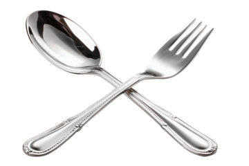 Elegant polished silver soup spoon and serving fork, beautifully crossed, creating sophisticated flatware display. Gleaming cutlery pieces present luxurious dining utensil arrangement