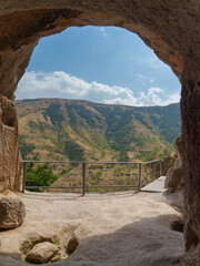 Fototapeta premium Mountain Landscape Viewed from Inside a Cave