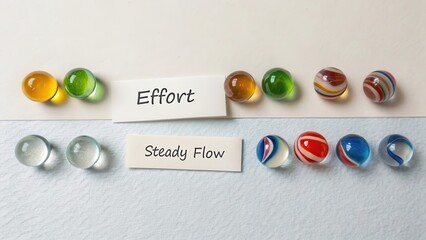 Contrast of Effort and Steady Flow with Colorful Marbles on Surface