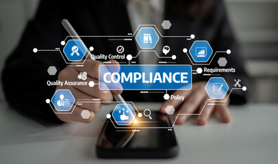 A professional working on compliance and quality assurance using modern technology. The image...