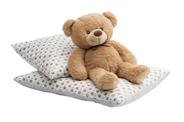 Cute teddy bear resting comfortably on patterned pillows for cozy bedtime relaxation moments