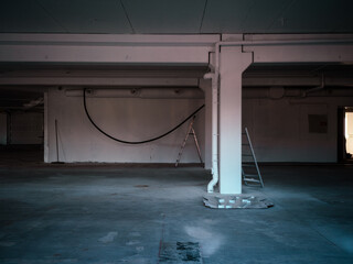 Old abandoned building with ladder and cables