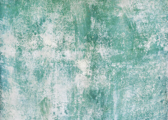 Textured abstract background featuring a blend of soft green and white hues, creating a visually appealing surface with a weathered, artistic appearance for creative projects