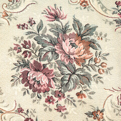 Seamless old-fashioned floral pattern on a tapestry fabric texture biege background old retro fashion closeup