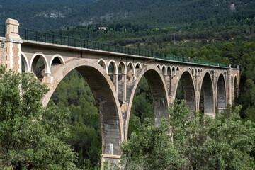 Architectural bridge Puente de las Siete Lunas, structure with elegant arches and steel rails,...