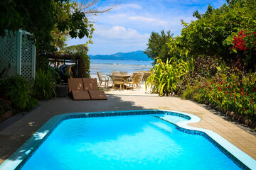 Tropical paradise Swimming pool, beach, and ocean view