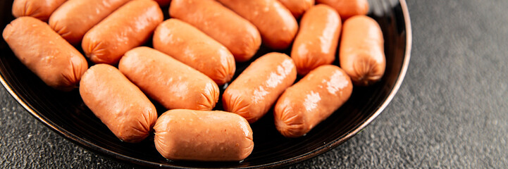 Mini sausages fresh delicious processed meat tasty snack fresh delicious gourmet food background on the table rustic food top view copy space