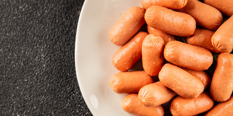 Mini sausages fresh delicious processed meat tasty snack fresh delicious gourmet food background on the table rustic food top view copy space