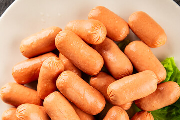 Mini sausages fresh delicious processed meat tasty snack fresh delicious gourmet food background on the table rustic food top view copy space