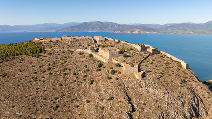 Aerial photo of medieval castle on top of an arid mountain