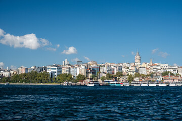 Fototapeta premium Golden Horn busy waterway with passenger ferries and boats from Karaköy viewpoint, Istanbul maritime transportation hub with historic skyline, Turkey