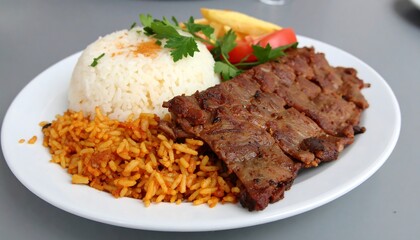 Exquisite platter: Grilled beef strips accompanied by a vibrant medley of rice varieties