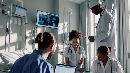 Medical team analyzing patient data on digital devices, collaborating in modern hospital setting, representing diverse healthcare professionals working together - Powered by Adobe