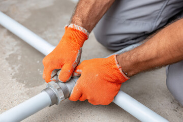 Tightening a pipe fitting in plumbing work