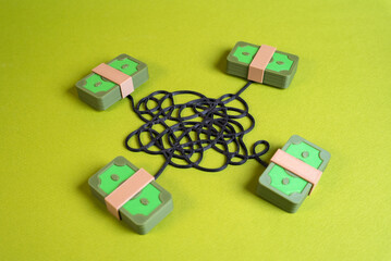 Fototapeta premium Money connected by tangled lines. Symbol of financial crime, corruption, and hidden networks. Suitable for money laundering, fraud, banking risks, and compliance control.