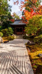 A serene Japanese garden with a traditional temple, showcasing intricate patterns in the raked gravel path, and vibrant autumn foliage.