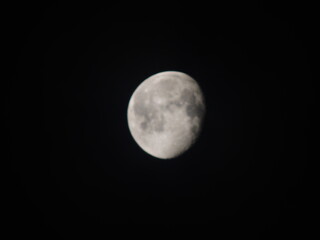 Detailed view of the waxing gibbous Moon against a black sky, showing craters and maria. A sharp, high-contrast astronomical capture.