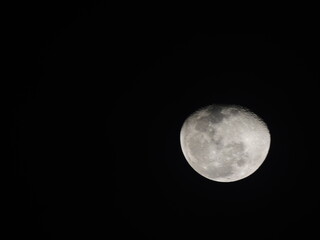 Detailed view of the waxing gibbous Moon against a black sky, showing craters and maria. A sharp, high-contrast astronomical capture.