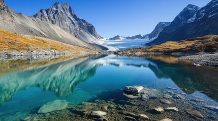 Fototapeta premium Serene alpine lake reflecting majestic mountains