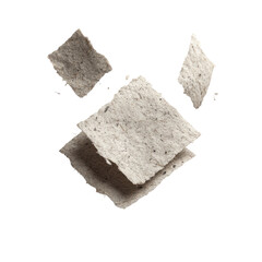 Light gray, square, crispy snacks in mid-air.  Several overlapping pieces, showing texture.  Studio shot, isolated background