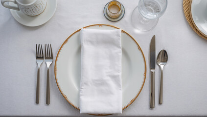 Set Table with White Napkin on Classic Fine China Plate