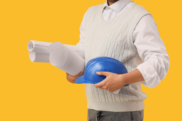 Man with hardhat and blueprint on yellow background