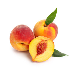 Sweet ripe peaches with leaves on white background