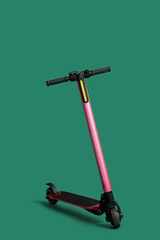 Modern electric scooter on green background