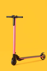 Modern electric scooter on yellow background