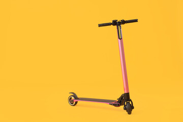 Modern electric scooter on yellow background