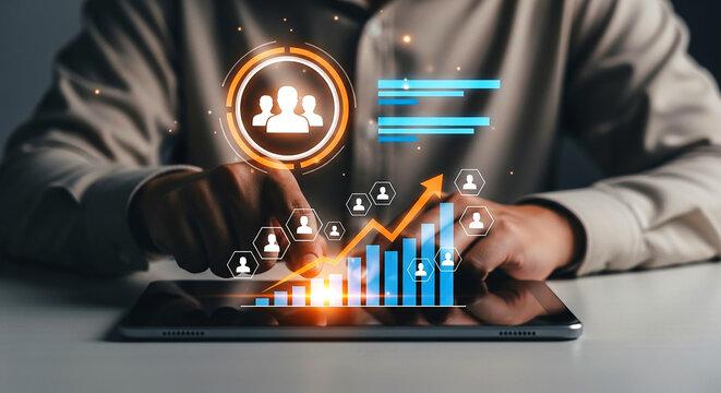 Person using tablet with digital business growth chart and team icon overlaying the screen view