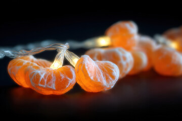 mesmerizing display of mandarin orange segments illuminated by ultrabright ar light creating enchanting nighttime