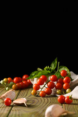 Red Cherry Tomatoes on Beige Cloth with Dark Backdrop