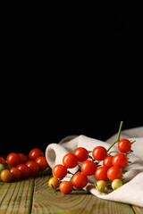 Fresh Organic Tomatoes Resting on Natural Fabric and Wood