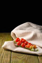 Juicy Garden Tomatoes on Wooden Table and Neutral Linen