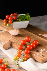 Organic Cherry Tomatoes on Kitchen Board with Fabric and Dark Contrast