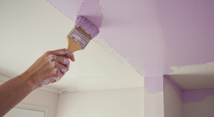 DIY bedroom ceiling painting with brush