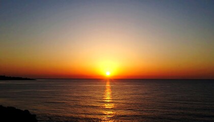 Golden sunrise over the ocean, a peaceful and bright morning view