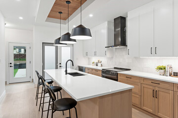 Kitchen with a white island and a black countertop