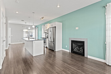 Large open kitchen with a fireplace and a refrigerator
