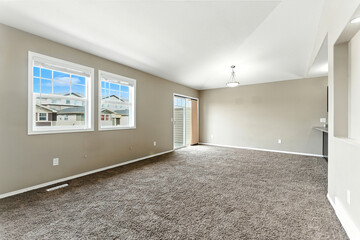 Large open living room with a tan wall