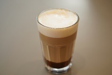 Latte in a Glass with Frothy Top layered