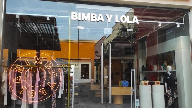 La Zenia, Spain - June 01, 2025: Bimba y Lola storefront showcasing vibrant fashion items and modern design elements in a lively shopping district