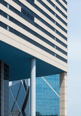 Obraz premium Sleek urban skyscraper architecture with striking blue