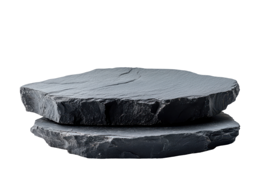 Rough dark gray stones stacked on each other isolated on transparent background. Flat rock podium for product display isolated on white background.