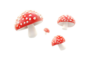 Obraz premium Group of red and white spotted fly agaric mushrooms isolated on transparent background. Fresh mushrooms falling isolated on transparent background.