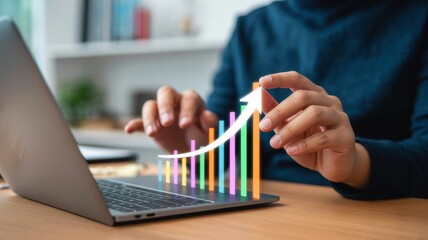 Man using laptop with digital graph showing business growth and success, symbolizing financial increase and positive market trends