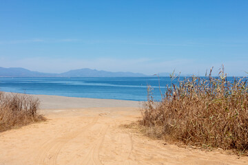 Strait of Gibraltar beach with Gibraltar Rock in view. Gibraltar, Spain. September 2025.